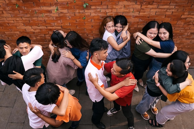 Group of multigenerational people hugging each others Support multiracial and diversity concept