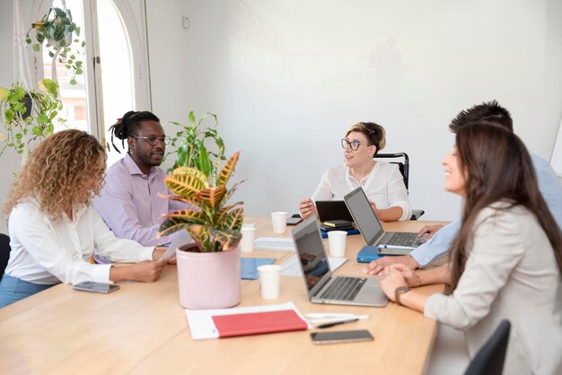 Group of multiracial corporate people sharing business ideas during the meeting