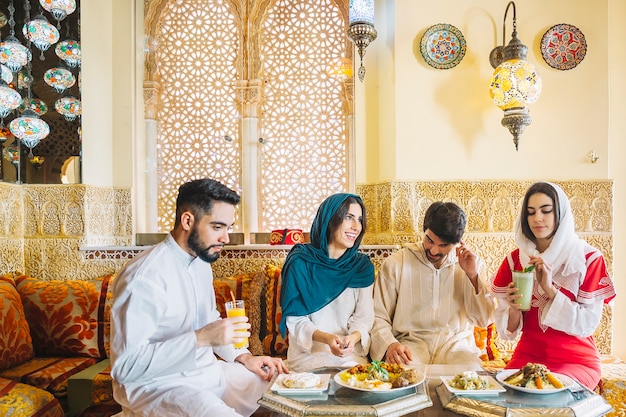 Group of muslim friends in restaurant