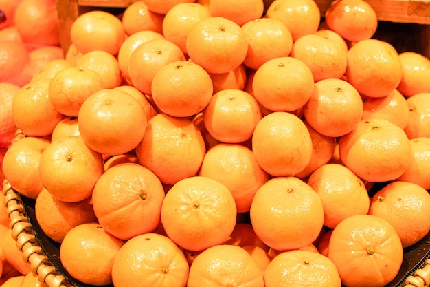 group oranges on the basket in the department store the photograph is close up and landscape