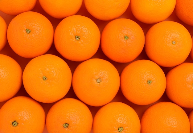 Group of oranges in a row on orange