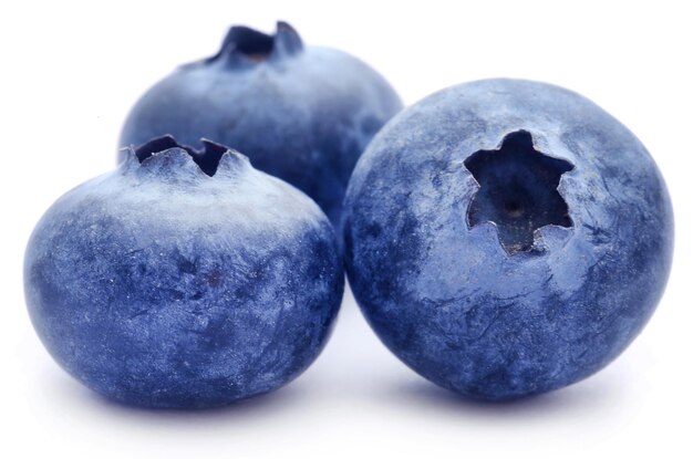 Group of organic blueberries over white background