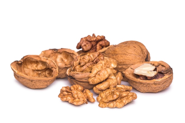 Photo group of peeled walnut kernels isolated on white background