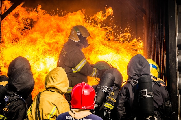 Group of people against fire