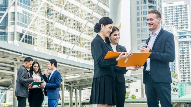 Group of people business in smartsuit meet at the outdoor city space