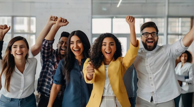 a group of people celebrating with their arms up in the air