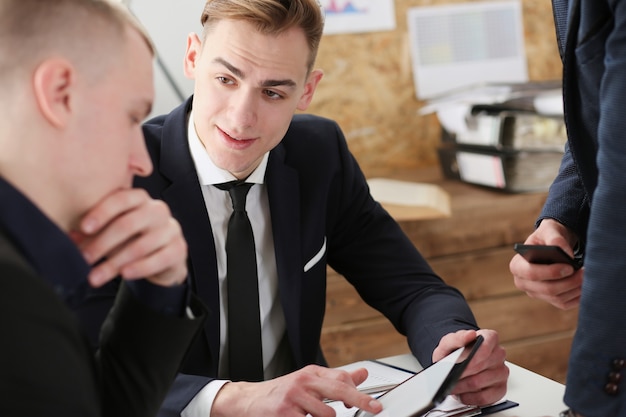 Group of people deliberate on problem