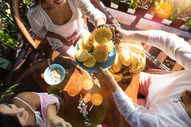 Group Of People Eating Breakfast Together Enjoy Fresh Pineapple