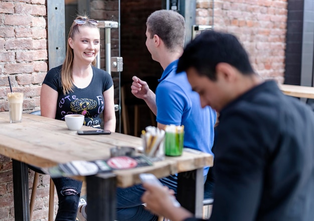 Photo group of people enjoying party in pub.