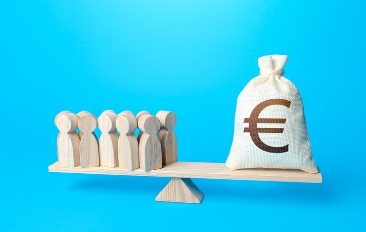 Photo group of people and euro money bag on weight scales required payment of staff salaries