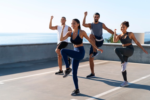 group of people exercising together outdoors