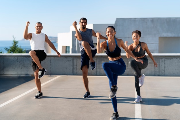 group of people exercising together outdoors