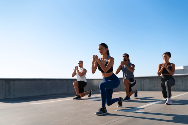 Group of people exercising together outdoors