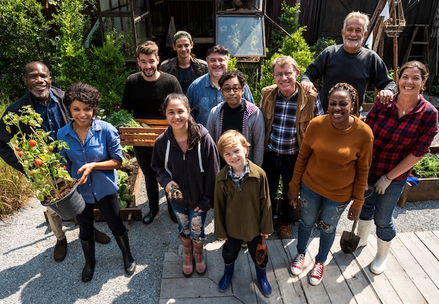 Group of people gardening backyard together