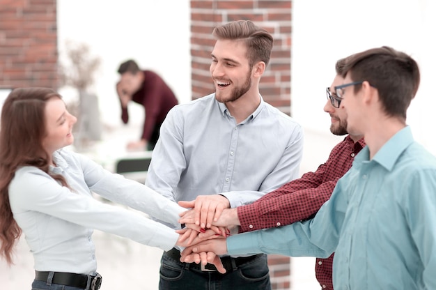 Group of people hands together partnership teamwork