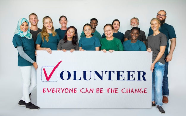 Photo group of people holding a banner