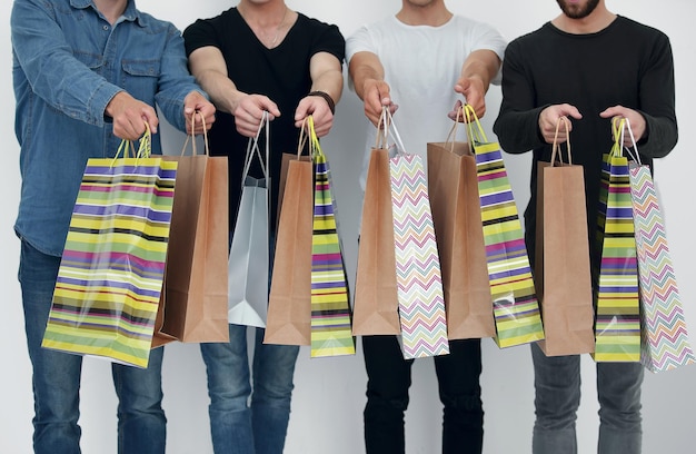 A group of people holds a gift bag