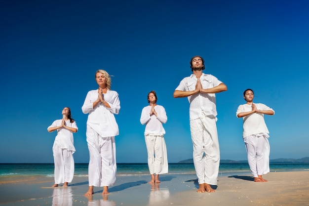 A group of people is meditating