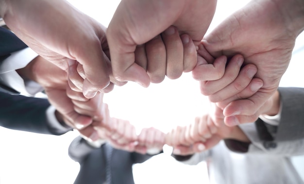 Photo group of people joined their hands