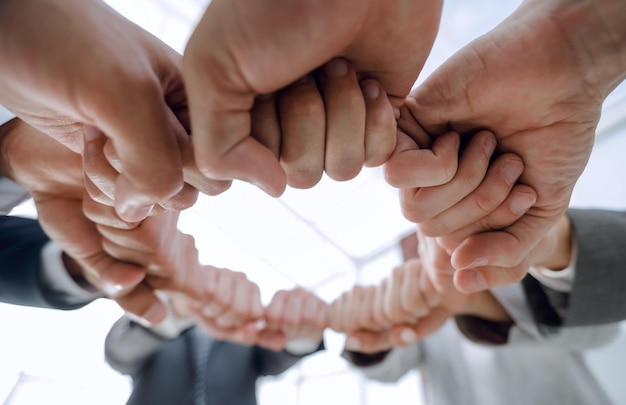 Photo group of people joined their hands