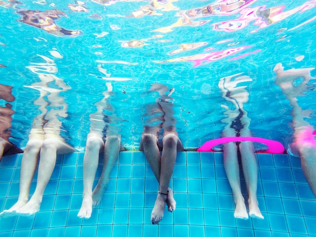 Group of people legs underwater