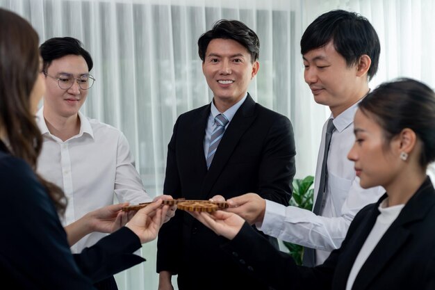 Group of people making chain of gears into collective form for harmony symbol