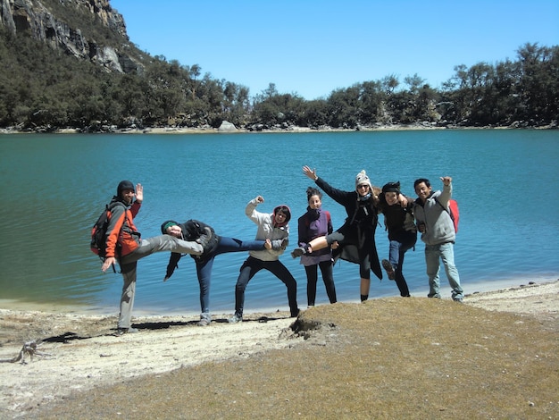 Group of people near a lake in the Peruvian Andes