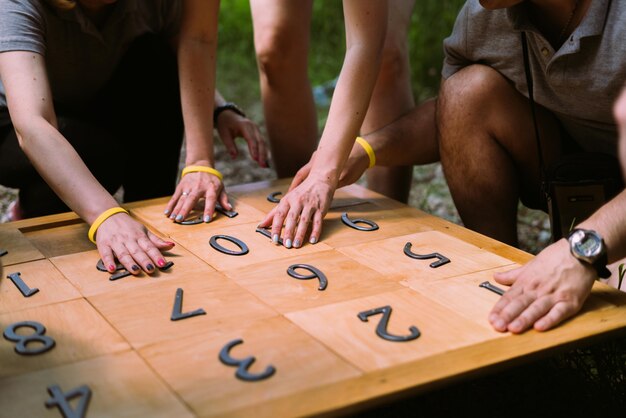 Group of the people playing game with numbers