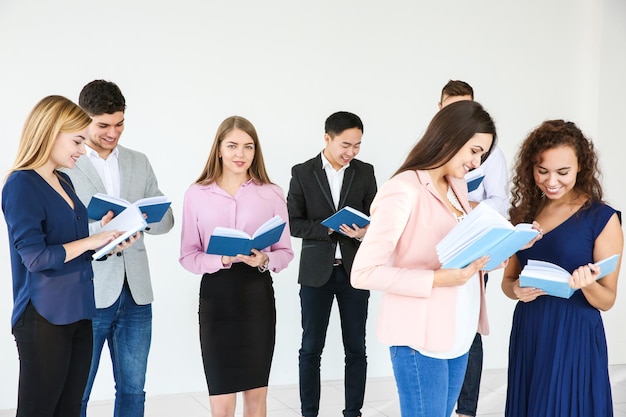 Group of people reading books in club