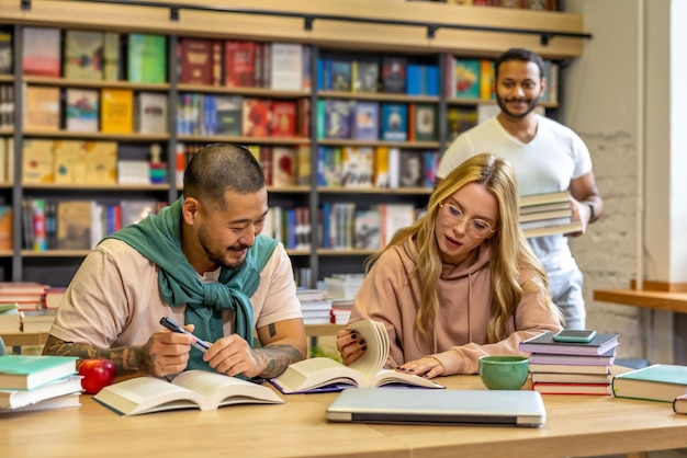 Group of people reading books in library