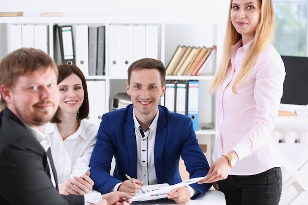 Group of people sit in office deliberate