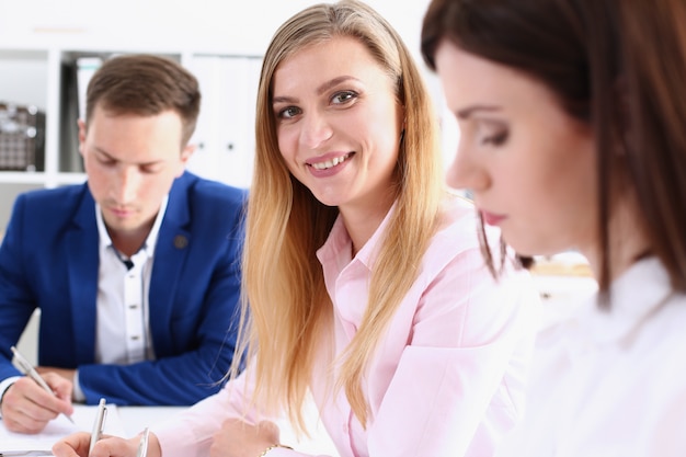 Group of people sit in office deliberate