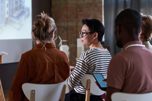 Group of people sitting at seminar