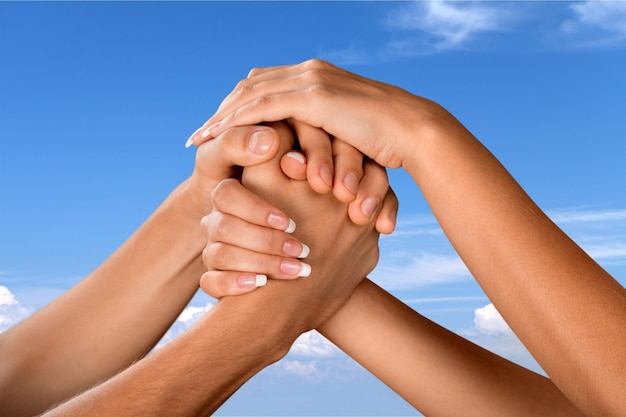 Photo group of people stacking hands together