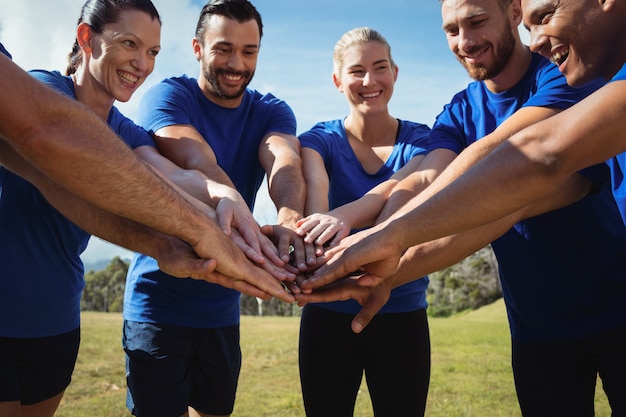 Group of people stacking their hands together