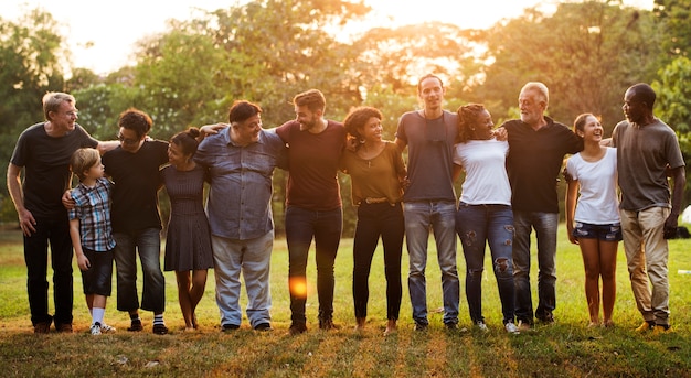 Group of people support unity arm around together