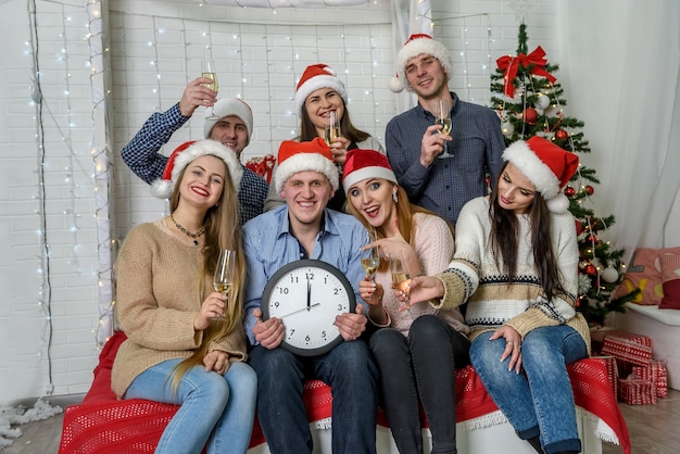 Group of people in sweaters celebrating new year