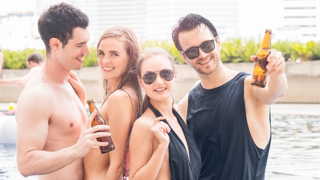 Group of people in swimming bikini nude dance and party in water pool with beverage of bottle of beer.