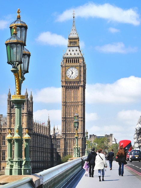 Group of people walking towards big ben in london