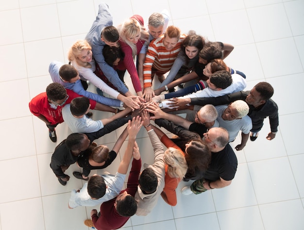 Group of people with hands together  teamwork concepts