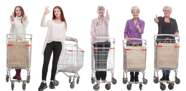 Group of people with shopping cart showing thumbs up