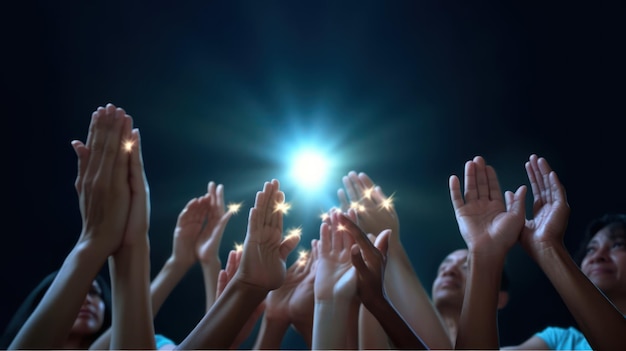 A group of people with their hands raised in the air