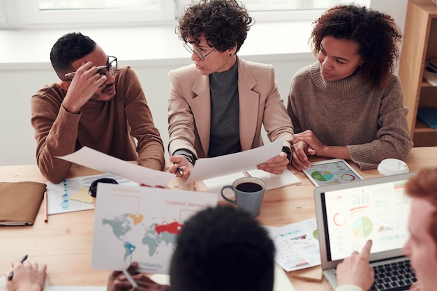 Group of people working out business plan in an office