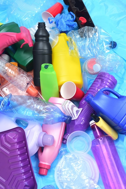 Group of plastic containers on blue plastic bags