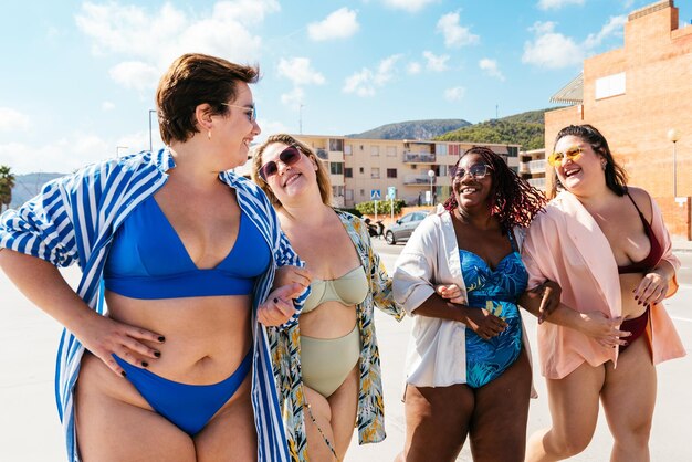 Group of plus size women with swimwear at the beach