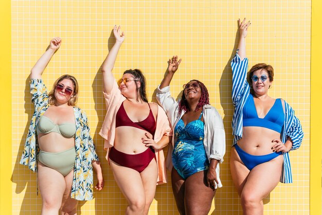 Group of plus size women with swimwear at the beach