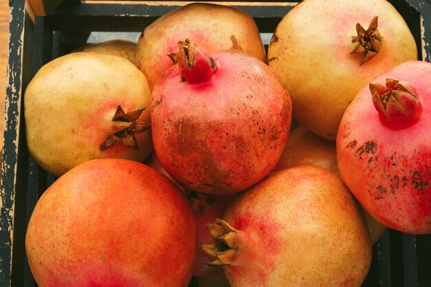 Group of pomegranate fruits close up background