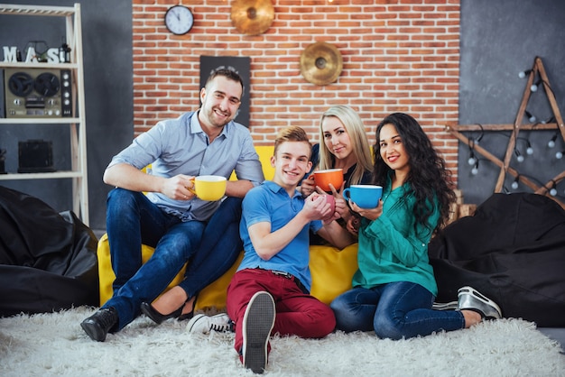 Group portrait of Cheerful old friends communicate with each other, friend posing on cafe, Urban style people having fun, s about youth togetherness lifestyle. Wifi connected