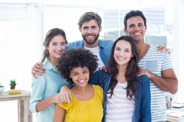 Group portrait of happy young colleagues