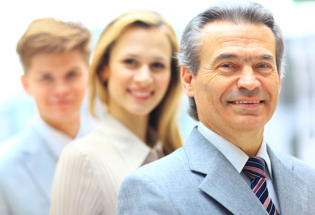 Photo group portrait of a professional business team looking confidently at camera